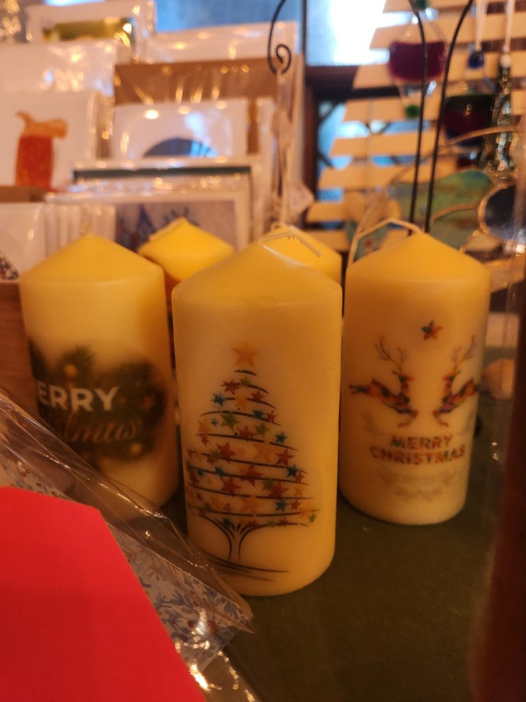 Trowbridge service users group art session created these Christmas Candles which are Now on sale at Town Hall