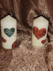 We have two hearts and flowers candles one with just hearts filled with roses and another with added tearful heart pierced by arrow