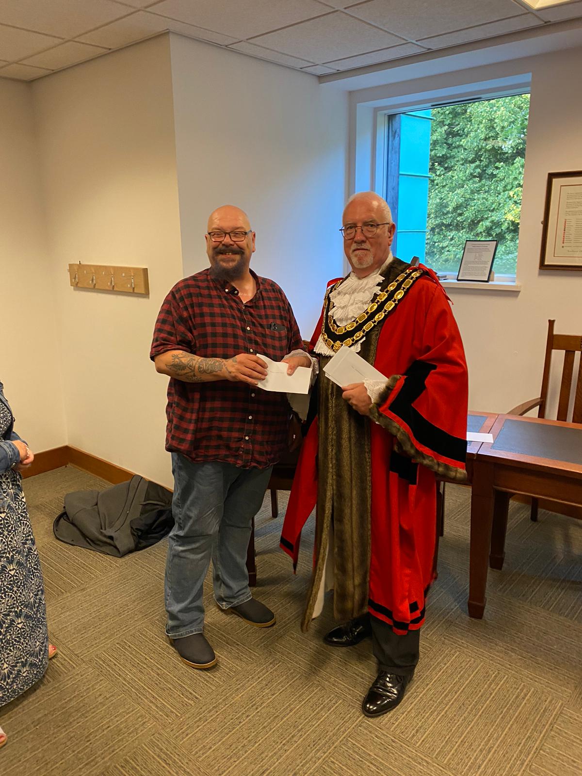 Mark Marshall receiving cheque from Mayor Councillor Stephen Cooper